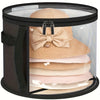 A black storage box with a clear window displaying several beige and pink straw hats stacked inside.