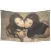 A photo tapestry featuring two women with dark hair posing closely together.