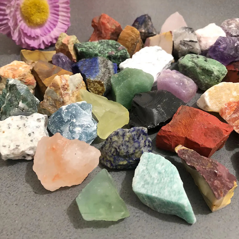 Assorted natural raw crystal stones and healing minerals in various colors and shapes.