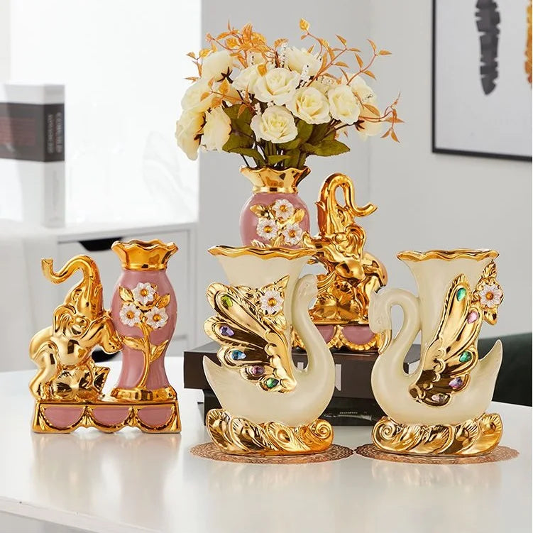 Gold ceramic swan vase for tabletop decor with pink and white floral accents