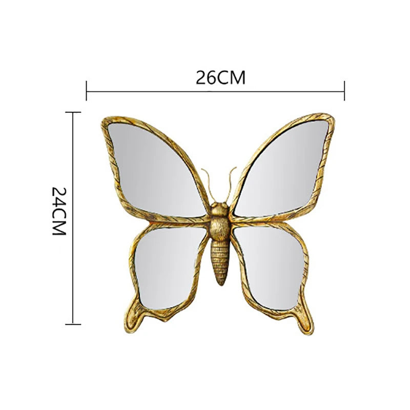Artisan butterfly wall mirror featuring a gold antique frame and reflective surface.