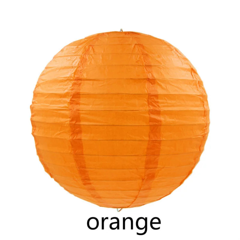 An orange decorative paper lantern, round in shape.