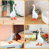 White decorative resin goose figurine with orange feet displayed in various contexts.
