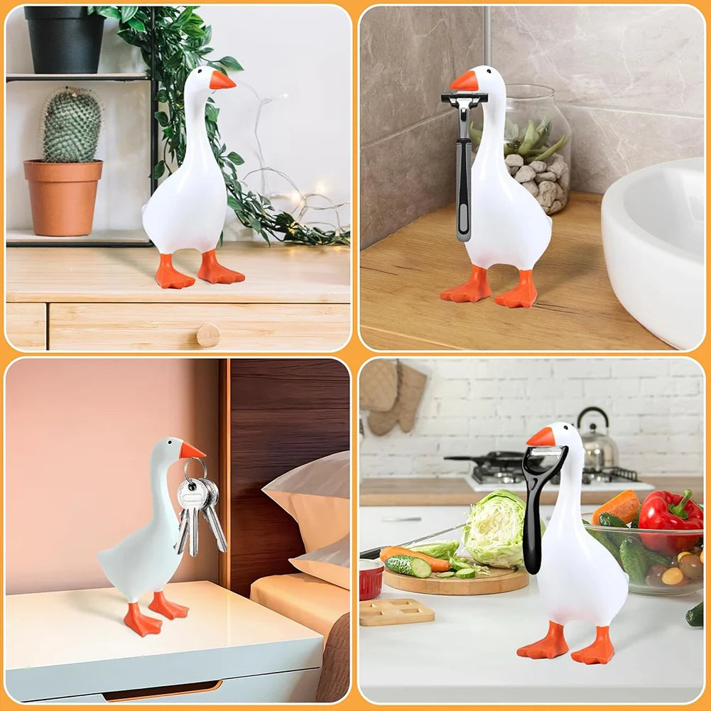 White decorative resin goose figurine with orange feet displayed in various contexts.