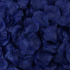 Dark blue artificial silk rose petals scattered closely together.