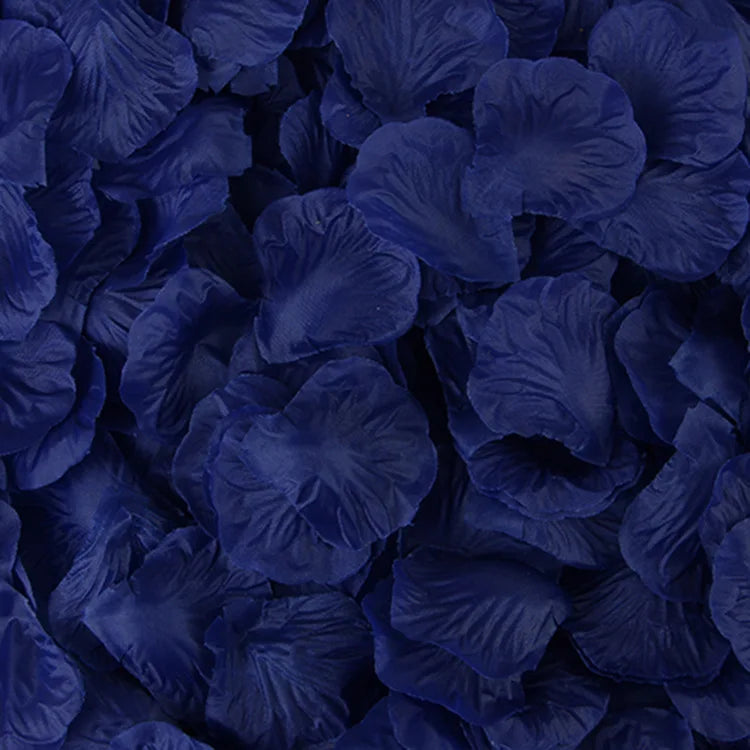 Dark blue artificial silk rose petals scattered closely together.