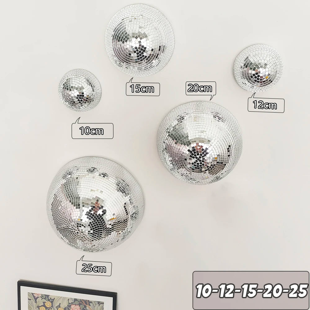 A collection of silver disco balls of various sizes, including 10cm, 12cm, 15cm, 20cm, and 25cm, displayed against a white ba