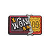 Enamel lapel pin featuring the text WON BA in gold glitter on a black background with a silver outline.
