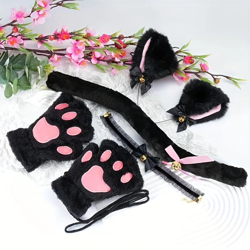 Black faux fur cat paw gloves with pink accents and a decorative headband displayed on white fabric.