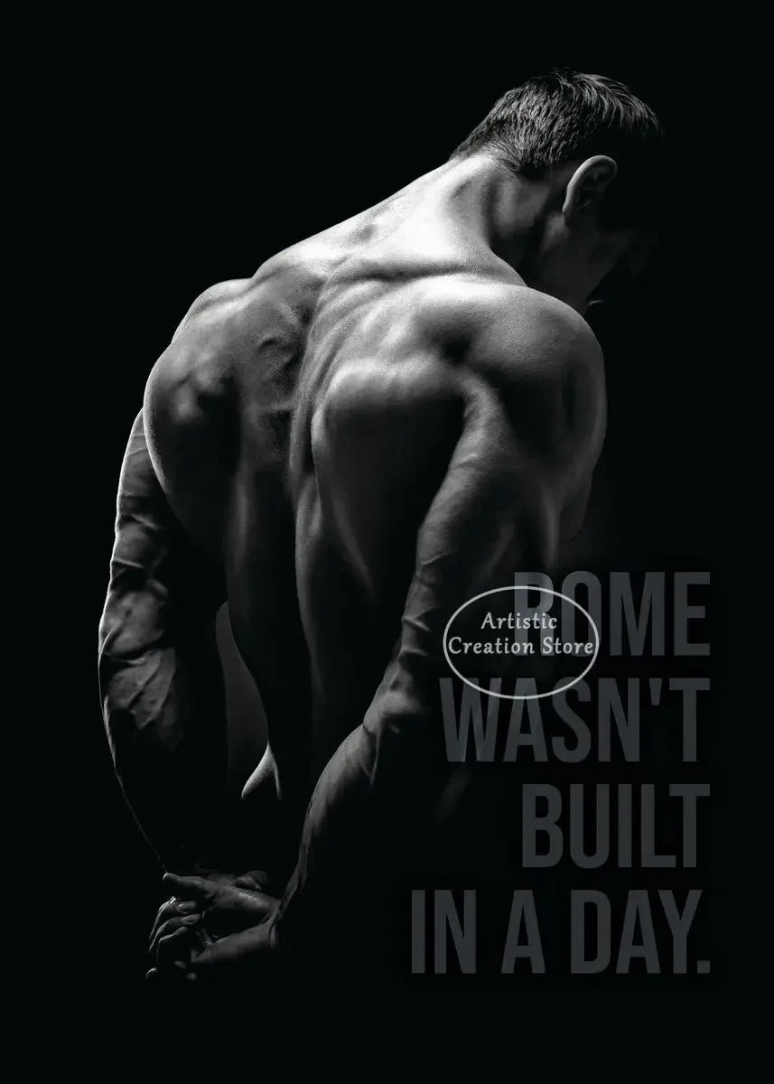 A muscular man's back is shown in a silhouette against a dark background, with text that reads Wasn't Built in a Day.
