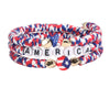 A set of patriotic American flag beaded stretch bracelets featuring red, white, and blue stripes and stars.