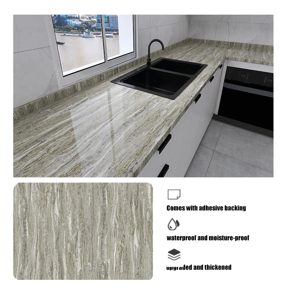 A marble pattern self-adhesive backsplash panel installed on a kitchen countertop with a sink.