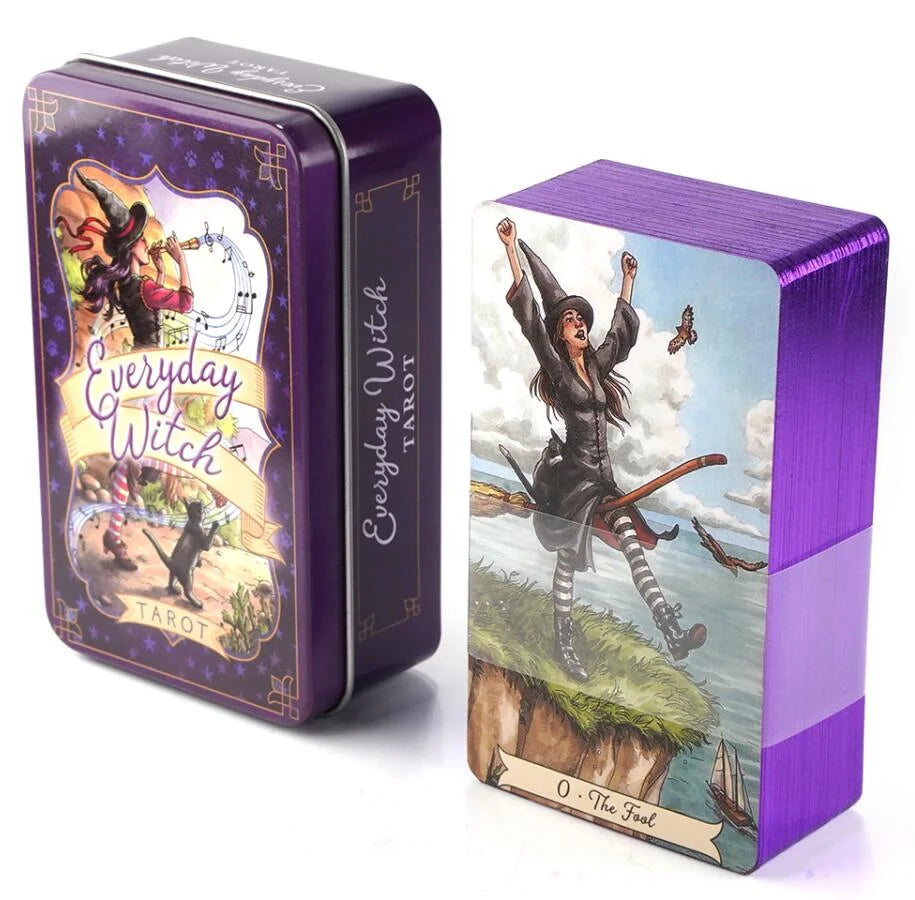 A purple metal tin box for an Everyday Witch Tarot deck featuring a witch figure and tarot imagery.
