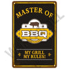 A vintage-style metal sign with the text MASTER OF BBQ LOW & SLOW and MY GRILL MY RULES!