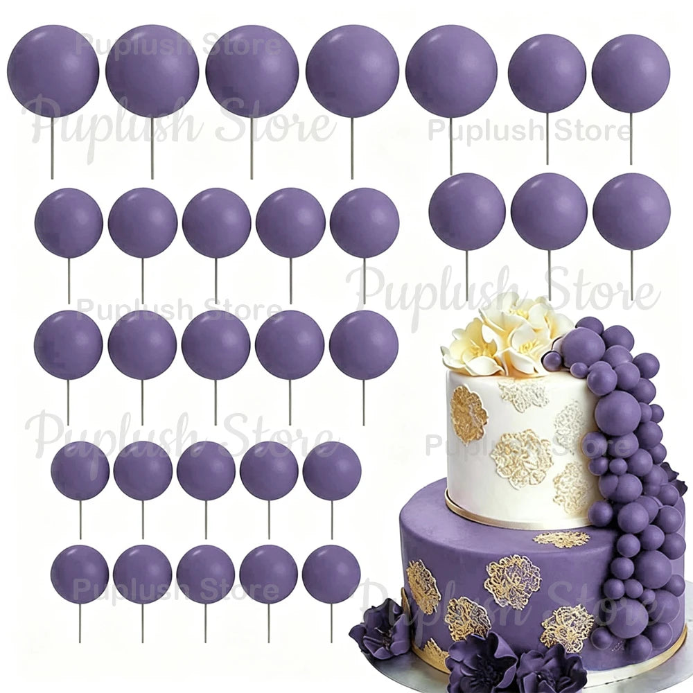 A set of purple foam cake toppers on sticks, including various sizes and shapes.