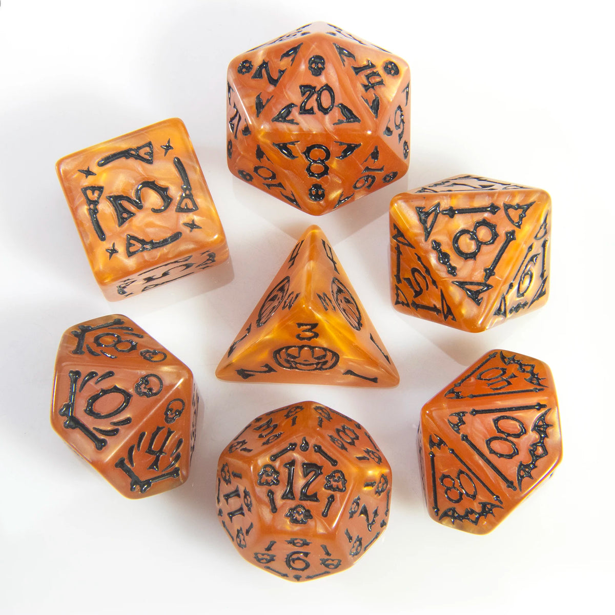 A set of seven polyhedral dice in amber and black tones arranged on a white surface.