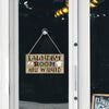 A vintage wooden farmhouse hanging sign with a leather cord and wooden plaque that reads Laundry Room Help Wanted