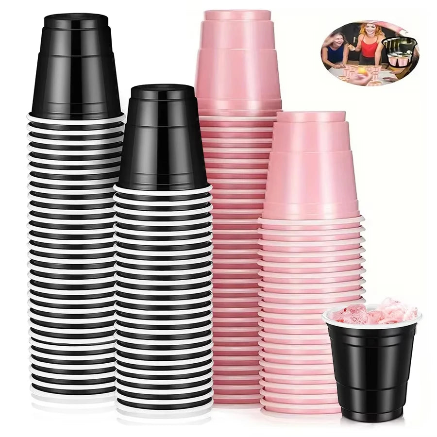 A set of black and pink striped mini plastic shot cups for parties and events.