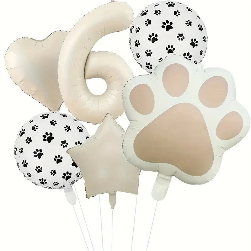 A set of six foil balloons featuring paw prints and the number six in white and beige colors.