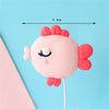 Pink fondant ocean animal cake toppers including a crab, turtle, octopus, whale, starfish, and shell decor