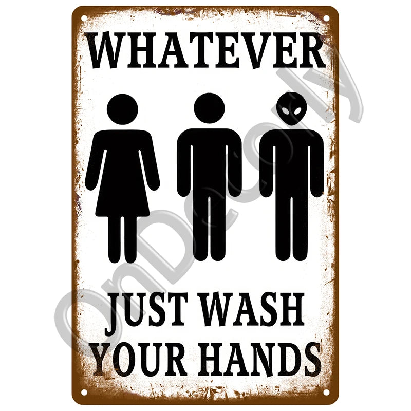 A vintage metal sign with black text that reads Whatever Just Wash Your Hands.