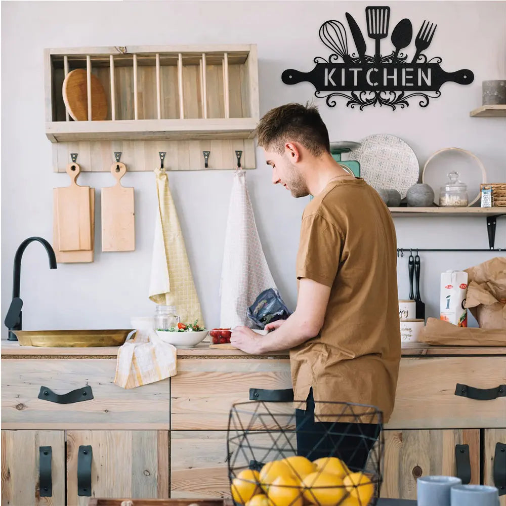 A rustic farmhouse metal wall sign for kitchen and dining room hangs above wooden cabinetry.