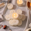 A collection of natural beeswax tealight candles in various sizes and a wooden stick are displayed on a light fabric.