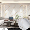 A close-up view of white marble contact paper showing natural veining and gold accents.