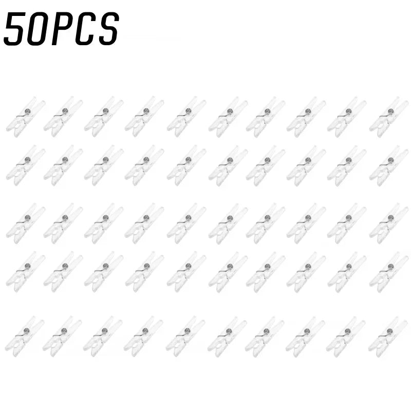 A collection of 50 clear plastic spring clips for photos, papers, and crafts.