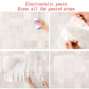Demonstration of electrostatic paste erasing pasted areas using a white cloth and clear film on a tiled surface.