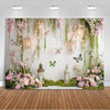 A floral and butterfly photo backdrop featuring pink and green foliage, hanging lanterns, and soft lighting.