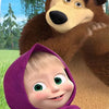 A cute girl wearing a purple hood is pictured next to a large brown bear.