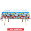 A colorful party tablecloth featuring characters and balloons for a Cocomelon themed celebration.