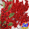 A close-up of artificial red holly berry stems used for Christmas decor.