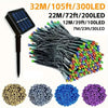 A collection of solar-powered LED string lights in various colors and lengths, including a light stick and multiple strands.