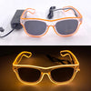 Pair of orange light up EL wire party glasses resting on a white surface and a dark background.
