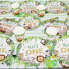 A set of green and white safari jungle themed tableware including plates and cups for a party.
