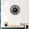 Black acrylic wall clock with intricate Arabic calligraphy design on a white background
