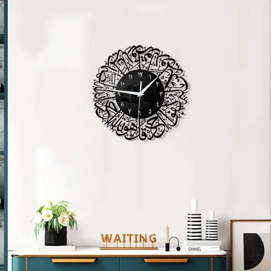 Black acrylic wall clock with intricate Arabic calligraphy design on a white background