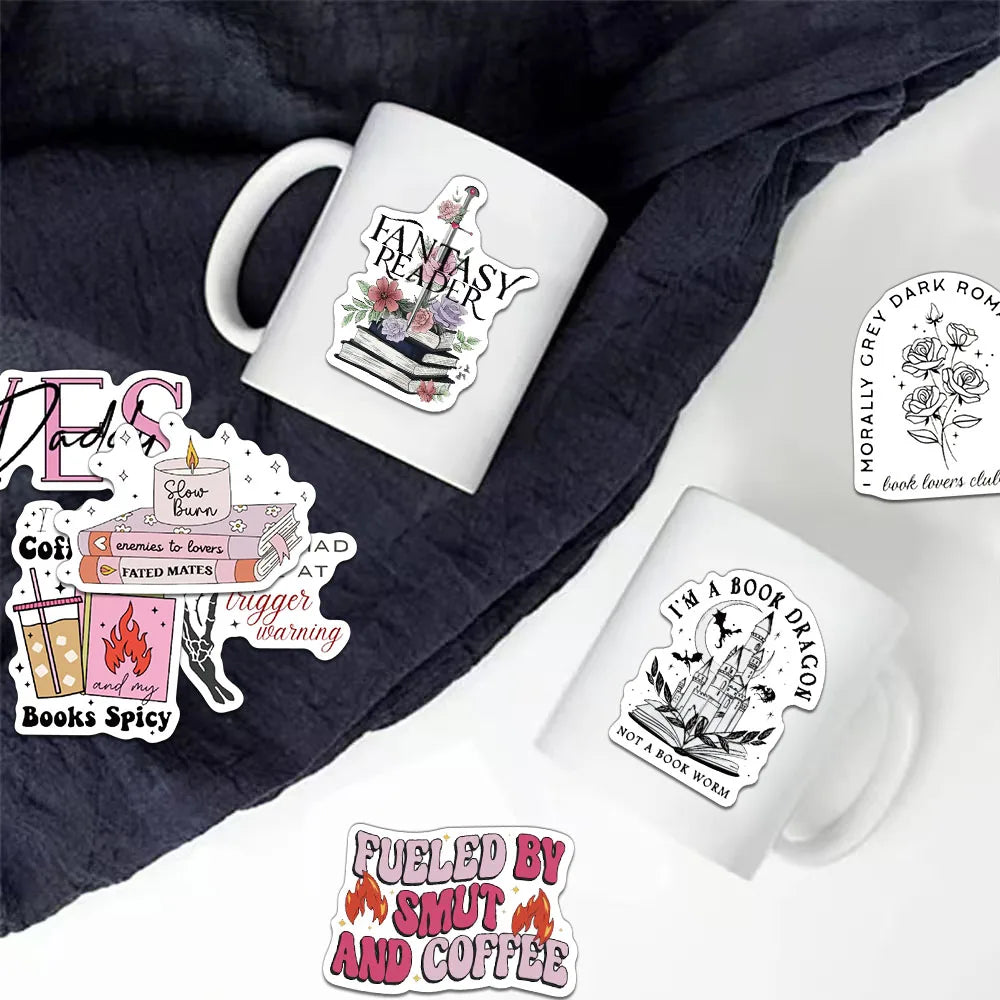 A white ceramic mug featuring a fantasy reader design is placed on a dark gray fabric.