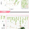 A display of green rose wall stickers featuring various floral and vine designs, shown in a home decor context.