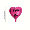 A single bright pink heart-shaped balloon with the words I love you printed on it.