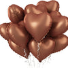 A cluster of shiny bronze heart-shaped foil balloons tied together, ready for parties and celebrations.