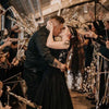 A couple is embracing amidst a shower of lighted tinsel wedding wands with LED glow.