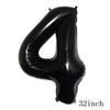 Black foil balloon shaped like the number 4 for party decorations