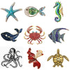A set of vintage marine life brooch pins featuring starfish, fish, crab, octopus, and turtle designs.