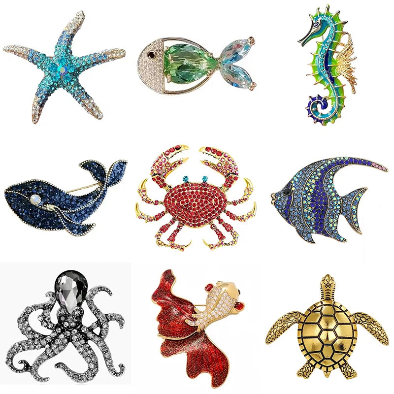 A set of vintage marine life brooch pins featuring starfish, fish, crab, octopus, and turtle designs.