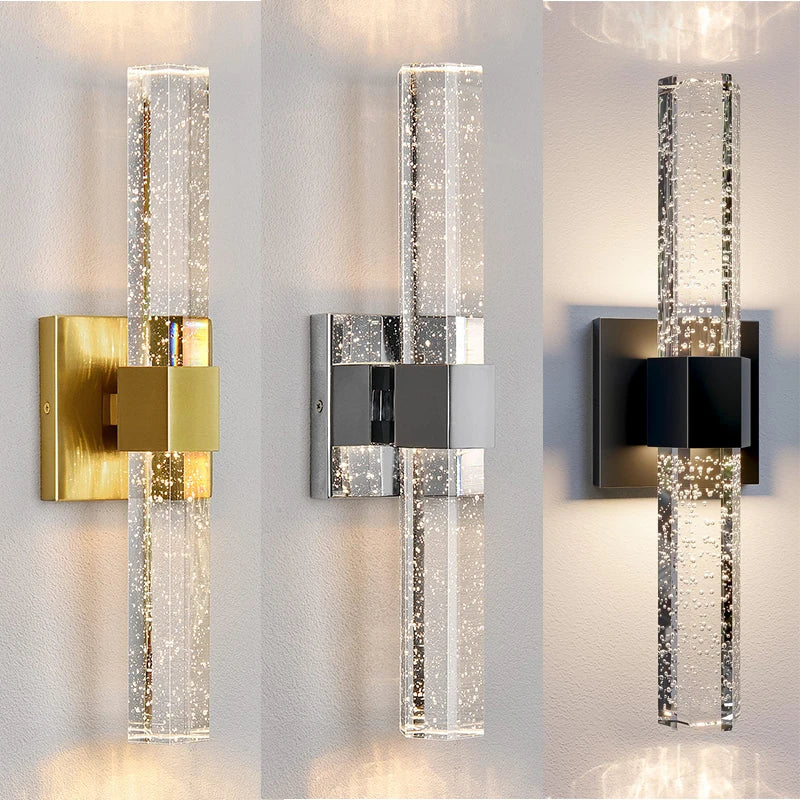 Modern bubble crystal LED wall sconces mounted on a white wall.