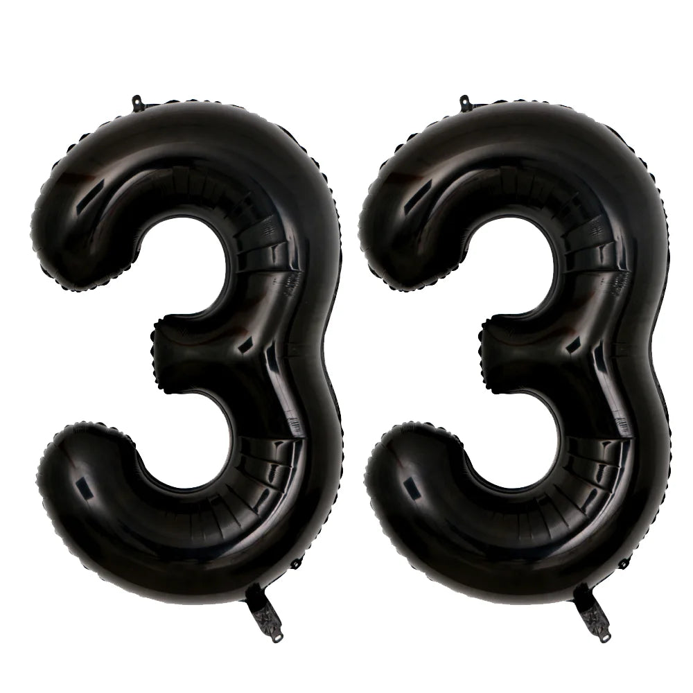 A set of two giant black foil balloons shaped like the number 33