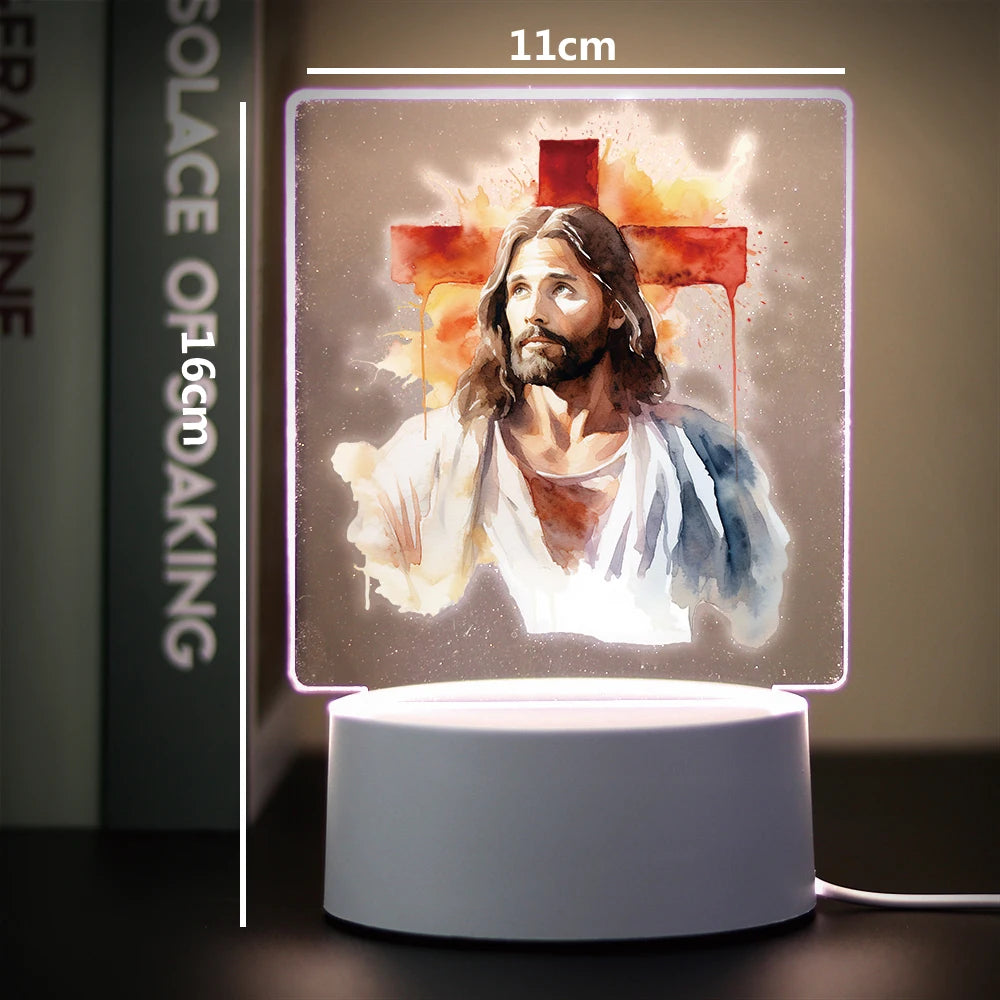 A glowing 3D LED night light depicting Jesus Christ with a cross on a square panel.